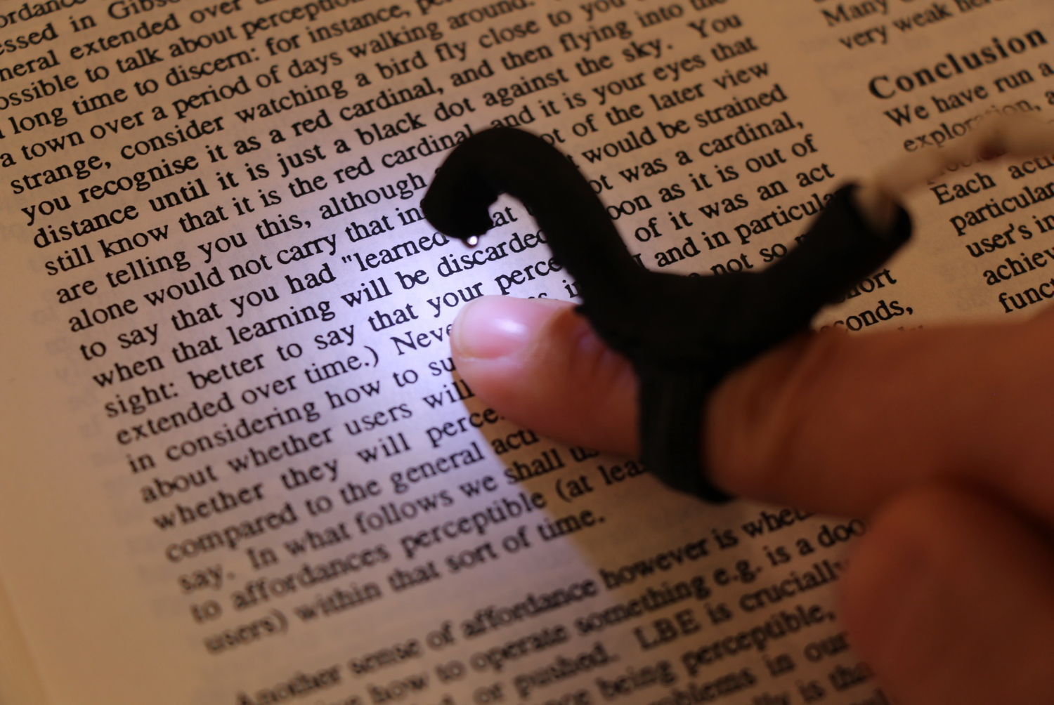 Reading printed text with a finger-mounted camera